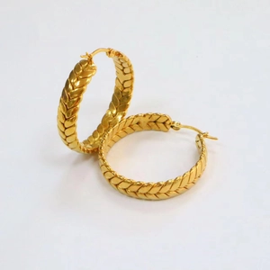 Detailed close-up of 18K gold-plated stainless steel wheat-patterned hoop earrings
