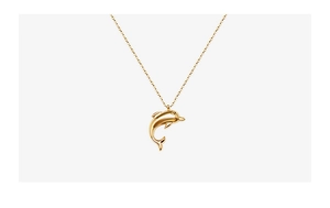 Close-up of a 18k gold-plated dolphin pendant necklace with a polished metallic finish