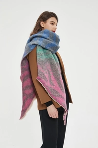 Detail of colorful chunky knit scarf with zebra pattern and fringed edges