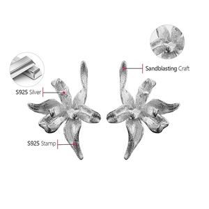 Macro detail of S925 sterling silver orchid earrings with professional sandblasting craft