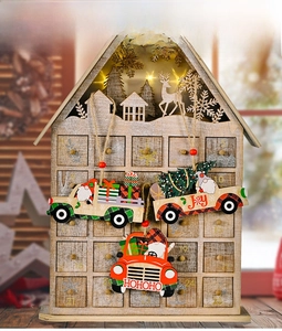Detailed view of wooden advent calendar house with 24 drawers and festive car ornaments