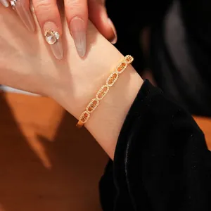 Elegant gold oval link bracelet with sparkling cubic zirconia pavé and luxury buckle clasp