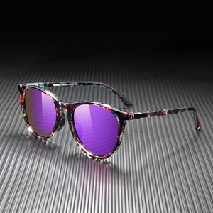 Detail shot of sunglasses with purple mirrored lenses and floral frame on a grey metal base