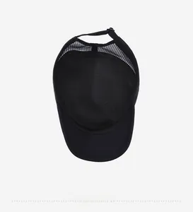 Detail view of the breathable mesh lining and inner structure of the black sun hat