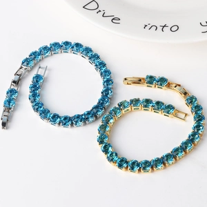 Detail of 6mm round cubic zirconia tennis bracelets in gold and silver plating
