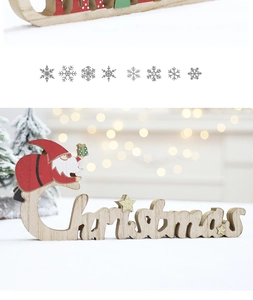 Detail of wooden Christmas sign with red Santa Claus and golden glitter stars