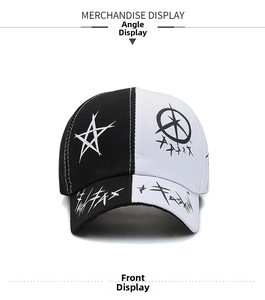 Detail view of baseball cap featuring black and white split panels and star print