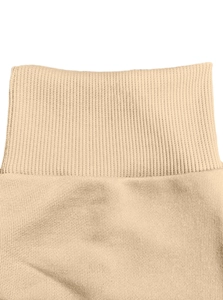 Macro shot of apricot ribbed knit neckline and stitching detail on men's hoodie