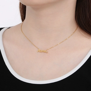 Gold 'Mama' letter necklace with diamond accent shown on model for Mother's Day gift set