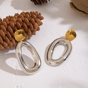 Two-tone oval drop earrings in gold and silver stainless steel with 18K gold plating finish