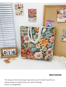 Detail of vibrant floral embroidery on canvas tote bag with thick cotton rope handles