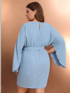 Back view of light blue dress with slit sleeves and matching waist belt for women