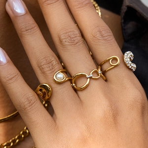 Golden minimalist rings set featuring faux pearls, rhinestones and paperclip design