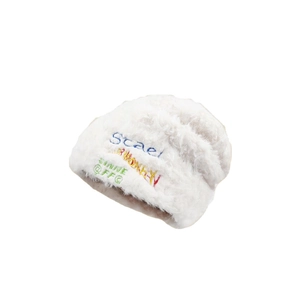 Fluffy white knit beanie with colorful embroidery for women winter warmth and style