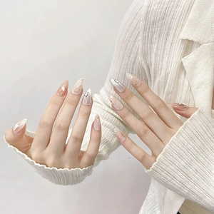 Elegant cat eye press-on nails with nude pink shimmer and shell inlay details