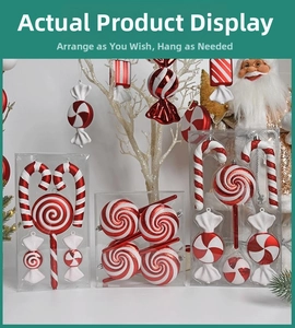 Detailed view of red and white striped Christmas candy ornaments with glitter on a white tree