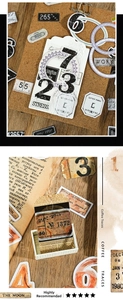Detailed view of vintage scrapbook stickers with gold stamping and retro paper texture