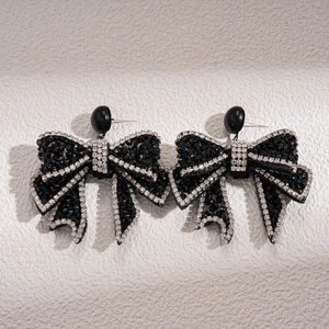 Dark gothic style bow earrings with black beads and sparkling rhinestone trim for women