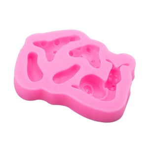 Pink silicone mold featuring snail and coral shapes for forest themed cake decoration