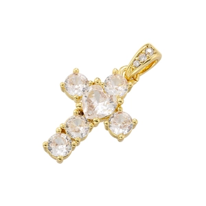 Detailed view of luxury gold cross pendant with micro-pave heart and round gemstones