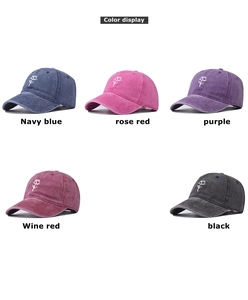 Detail display of five colors of washed denim baseball caps with rose embroidery