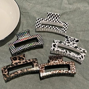 5-piece geometric hair claw clip set with leopard, checkerboard, and cow print patterns