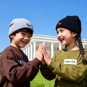 Kids knitted beanie hats with dinosaur embroidery for winter warmth and wind protection