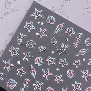 Macro detail of 3D embossed ocean nail stickers with laser holographic shell and starfish designs