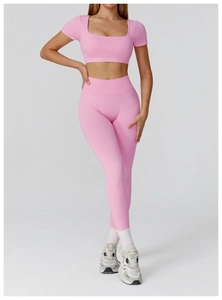 Detailed close-up of pink seamless yoga set with square neck crop top and high waist leggings