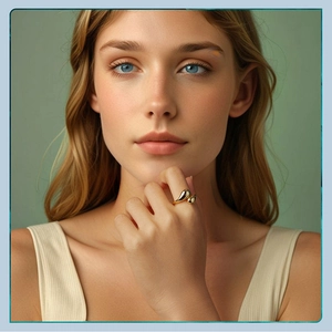 Detailed view of an adjustable gold teardrop ring worn on a finger for a chic look