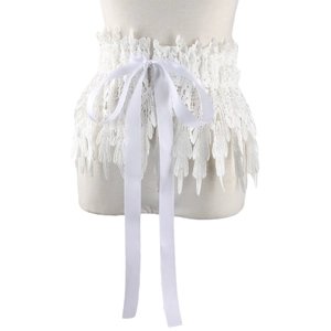 Detail of white lace waist belt featuring floral patterns and a satin ribbon bow tie