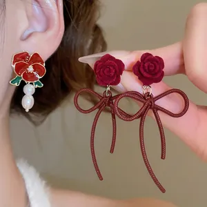 Elegant rose flower bow drop earrings with pearls for a vintage aesthetic style