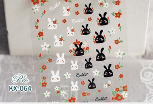 Detailed macro view of 5D nail art stickers with rabbit and flower patterns KX-064