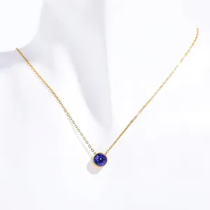 Detail of September royal blue birthstone pendant on a gold stainless steel necklace