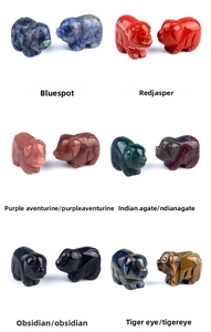 Macro shot of various hand-carved natural gemstone pig figurines in six crystal textures