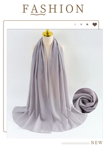 Detail of light gray pearl chiffon scarf showing soft texture and elegant drape