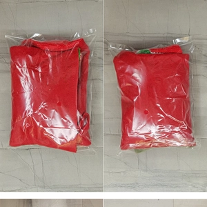 Detail of red Nordic Christmas stocking decoration packed in clear protective plastic bag