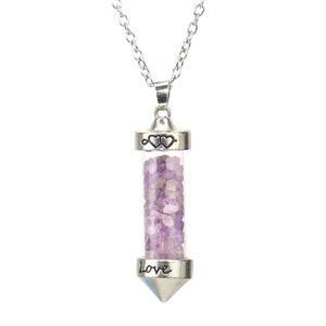 Detail of love-engraved glass pendant necklace filled with purple crushed crystal stones
