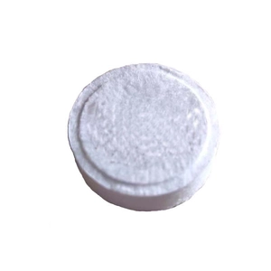 Portable compressed white circular disposable face towel for travel and skincare