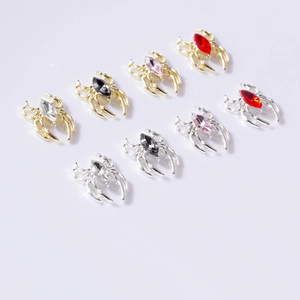 Alloy spider nail art charms with marquise rhinestones in gold and silver settings