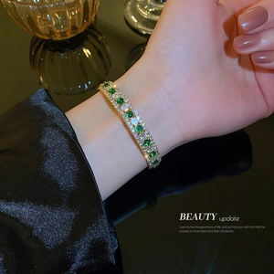 Elegant three-row square pave bracelet with green and white gemstones in gold finish