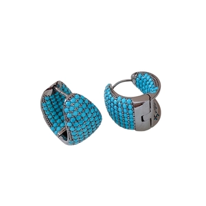 Asymmetric zircon water drop earrings with pave-set teal gemstones in dark metal