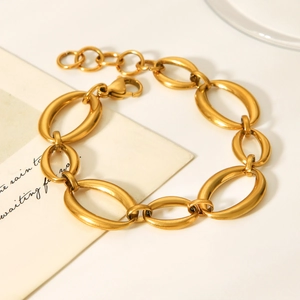 Detail of 18K gold plated stainless steel bracelet with large oval link design