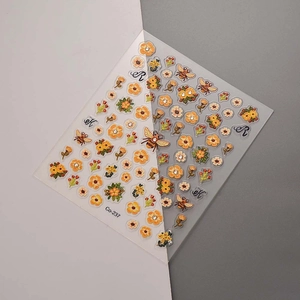 Macro detail of 3D embossed sunflower and honeybee nail art stickers with Co-237 code