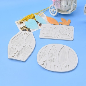 Macro detail of three-piece white silicone molds featuring realistic leaf vein textures