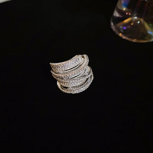 Detailed close-up of multi-layer silver wrap ring with micro-paved cubic zirconia stones