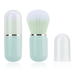 Portable capsule makeup brush with mint green handle and white-to-green gradient bristles
