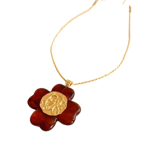 Vintage resin flower pendant necklace with red petals and gold floral center detail