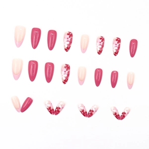 Pink almond press-on nails set with French tips and cute floral patterns on white background