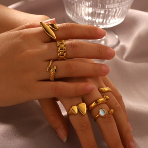 18K gold plated stainless steel ring set with geometric and heart shapes on silk cloth